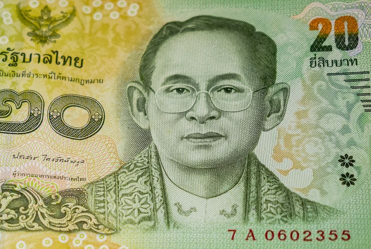 Thai 20-baht banknote representing currency and investment in Thailand.