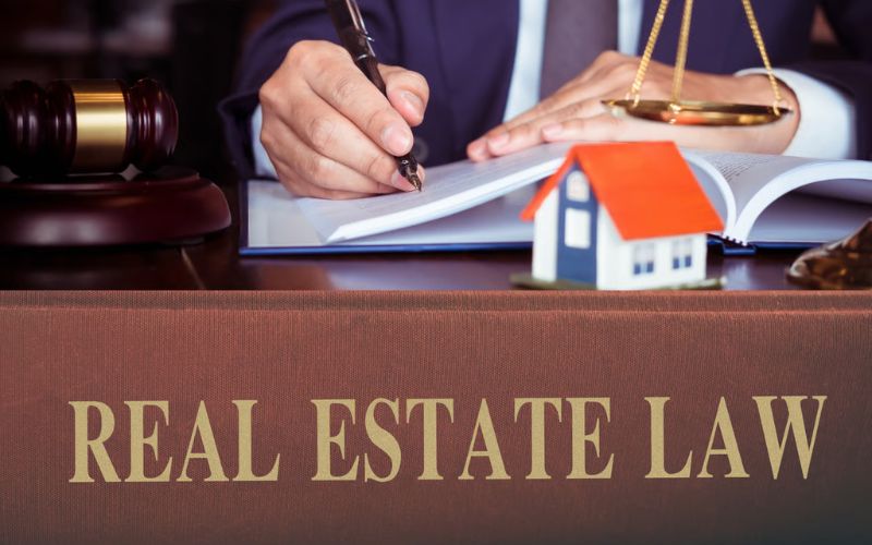 Legal professional reviewing real estate documents and property regulations in Vietnam