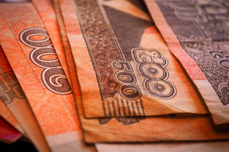 Cambodian riel banknotes representing investment opportunities in Cambodia.