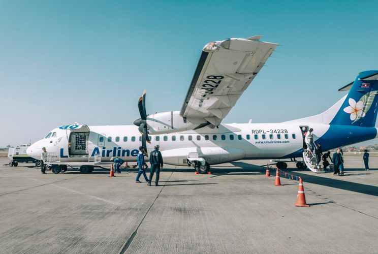Transport aircraft parked at an airport in Laos.