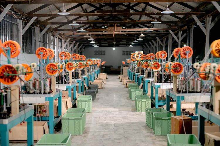 Textile production machinery inside a factory in Cambodia.